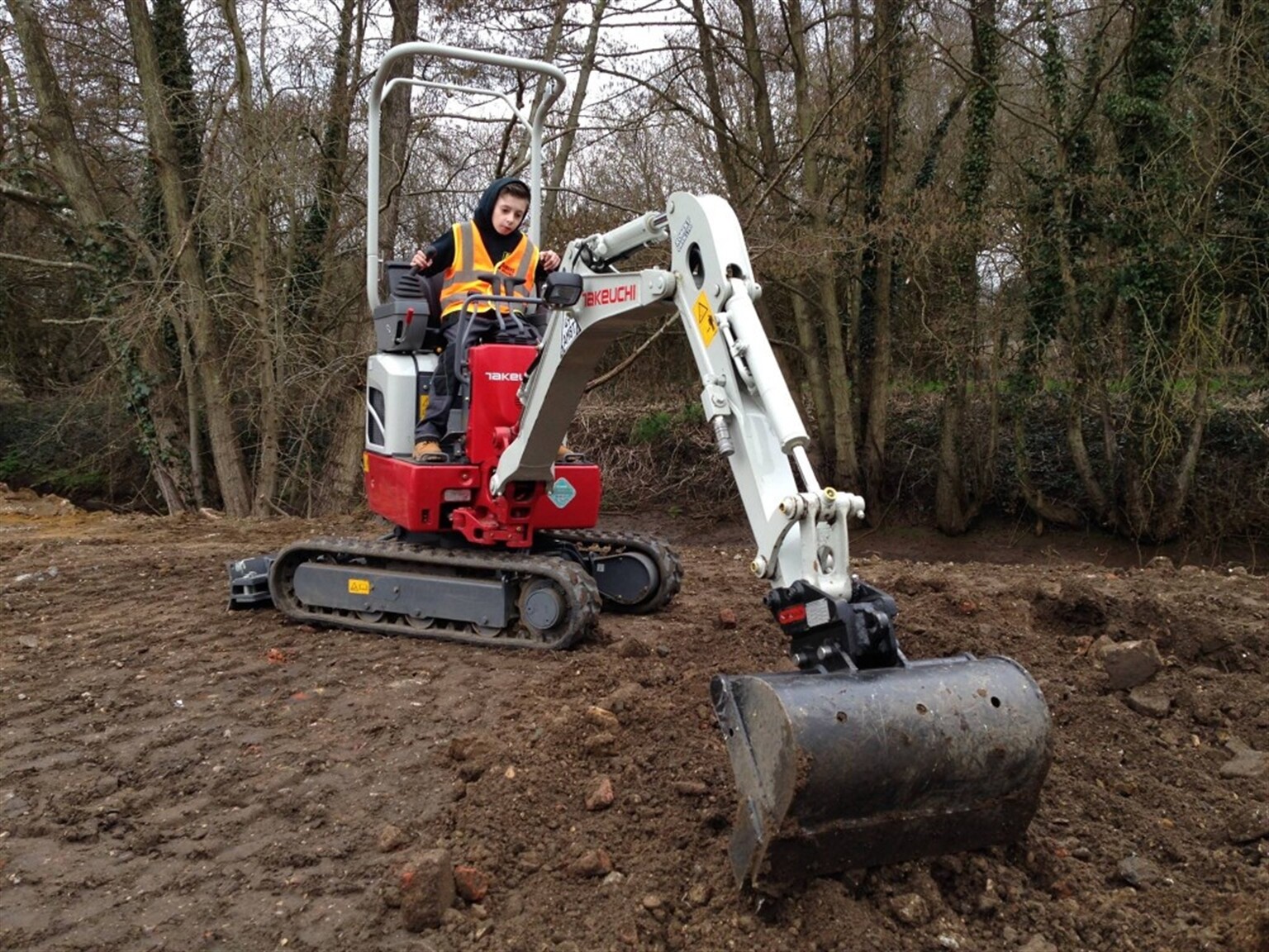 Young digger fan gets to grips with Takeuchis new baby